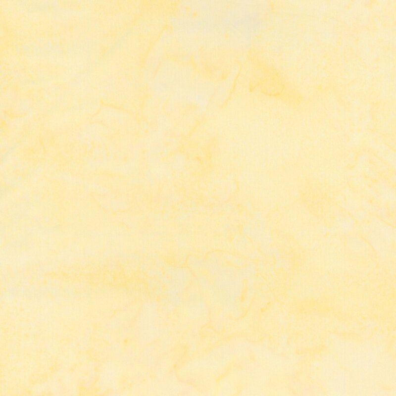Mottled butter yellow tonal batik fabric