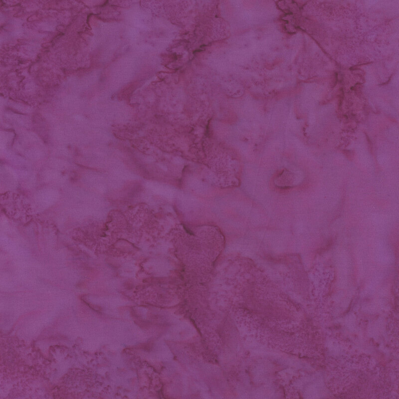 Mottled vibrant magenta tonal batik fabric