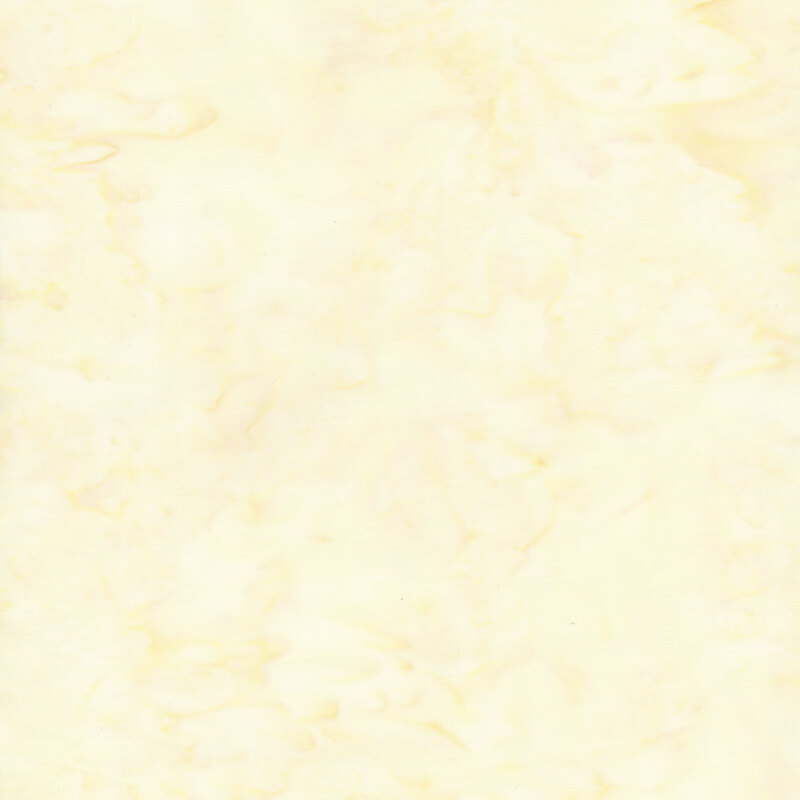 Mottled light yellow and cream tonal batik fabric