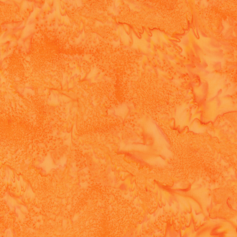 Mottled bright ornage tonal batik fabric