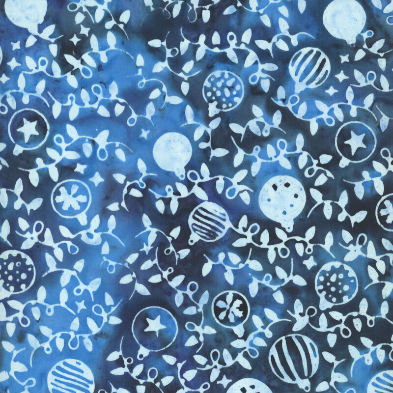 Variegated navy and bright blue fabric with a pattern of light blue Christmas ornaments and string lights 
