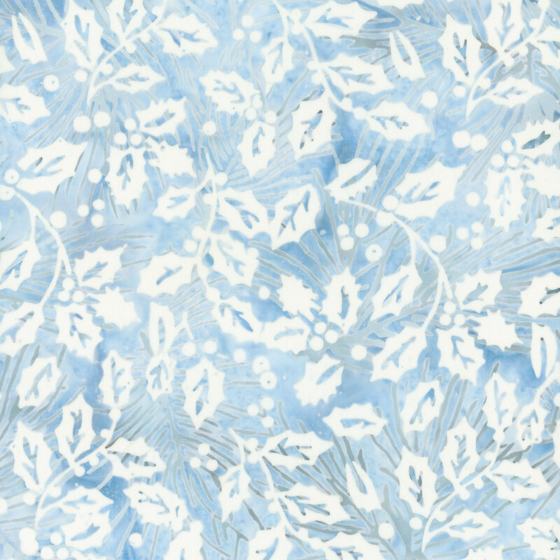 Faded blue mottled fabric with gray pine needles, and a white overlay of holly leaves and berries