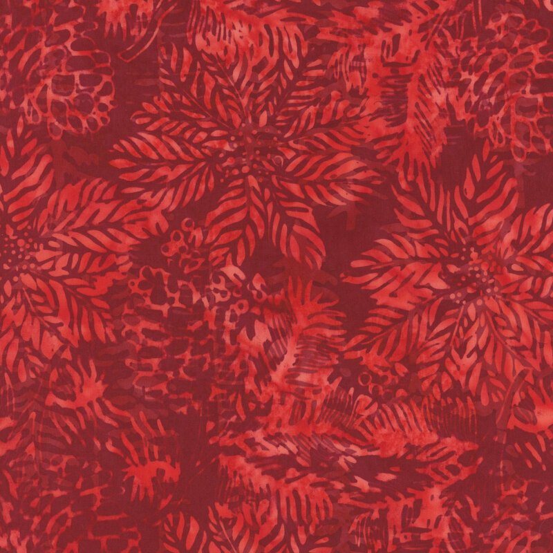 Mottled crimson fabric with a radiant scarlet overlay of poinsettia flowers and pinecones