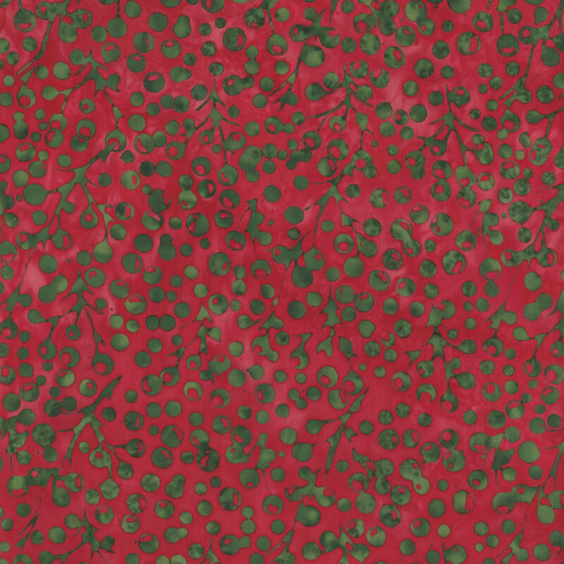 Crimson mottled fabric with a dense pattern of green of holly berries