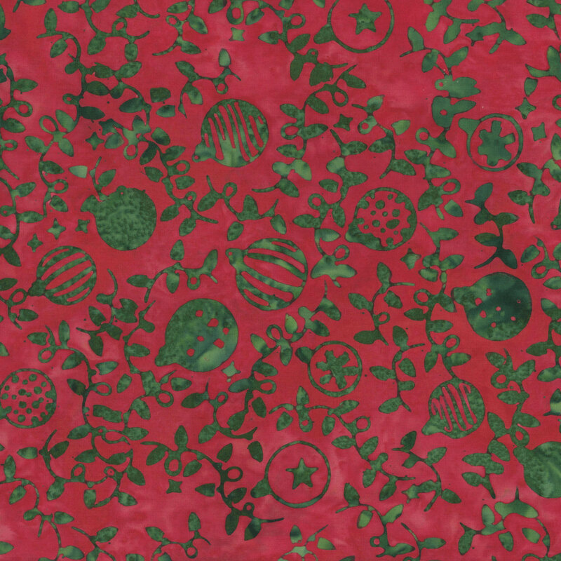Subtly mottled crimson fabric with a pattern of spruce green Christmas ornaments and string lights 