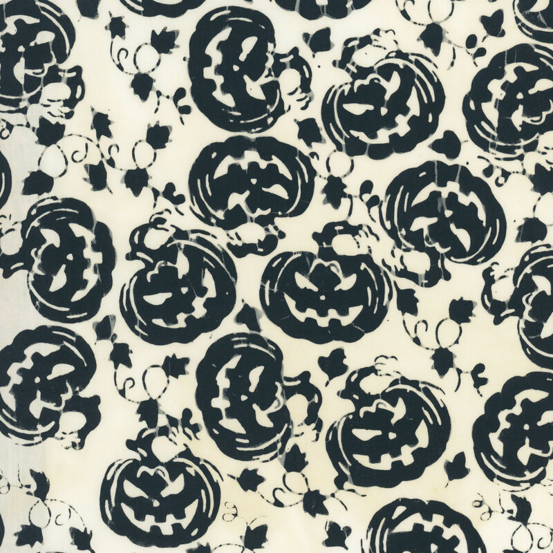 Mottled off-white fabric featuring frightening black silhouette carved pumpkins.