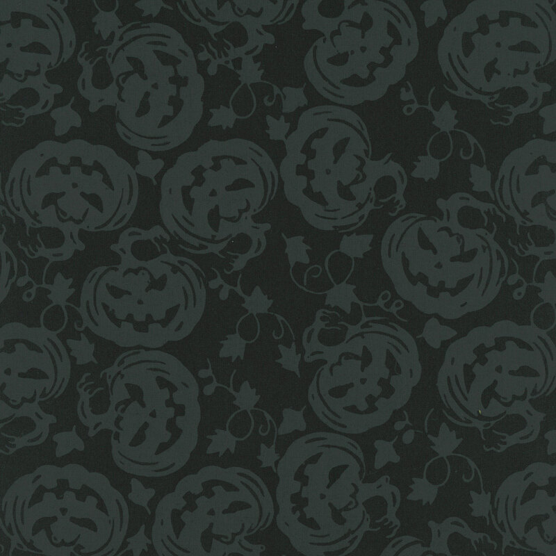 Black fabric featuring frightening tonal silhouette carved pumpkins.