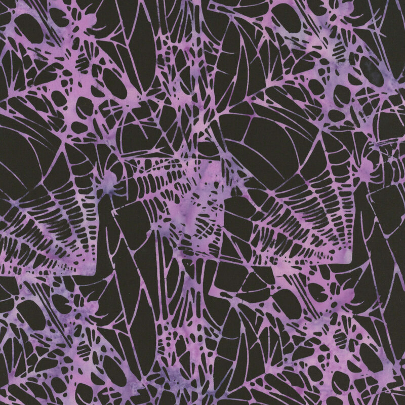 Black fabric covered in purple spider webs.