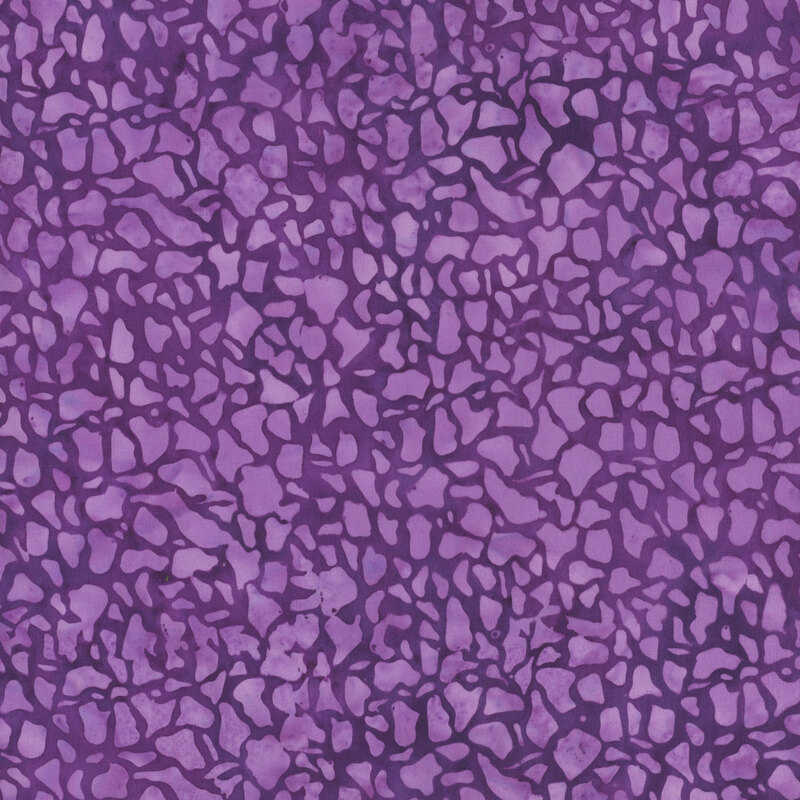 Tonal purple fabric with abstract shapes.