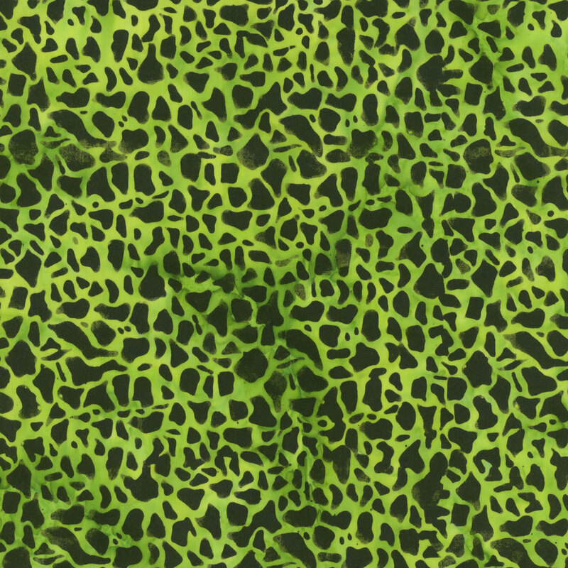 Mottled lime green fabric featuring an abstract design.