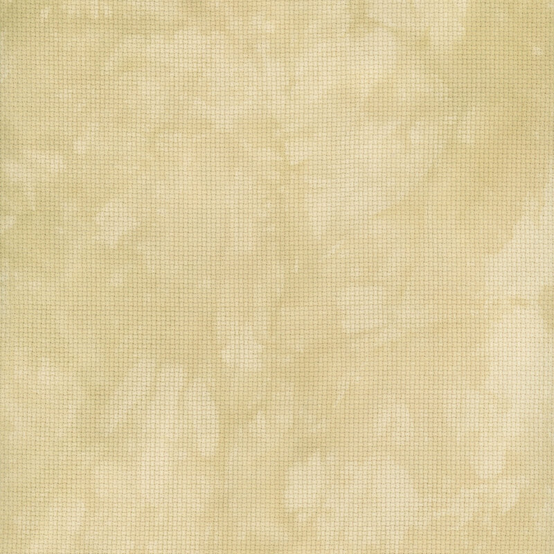 A close up swatch of marbled 14ct aida cloth in a soft tan yellow color by Fabric On A Whim.