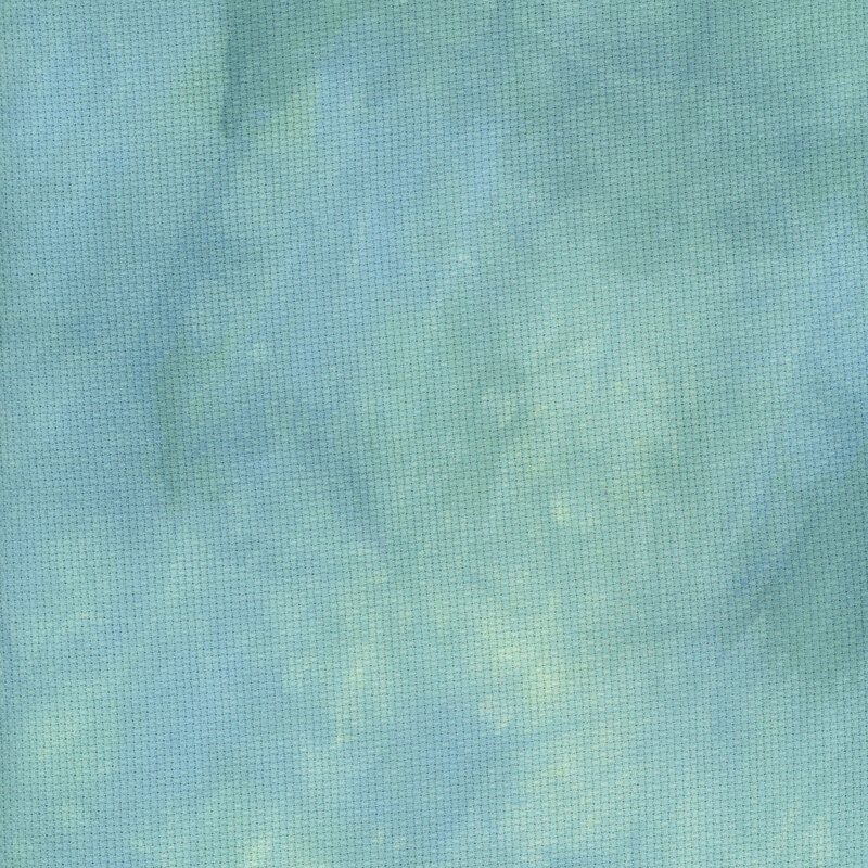 A close up swatch of marbled 14ct aida cloth in a jade green color by Fabric On A Whim.