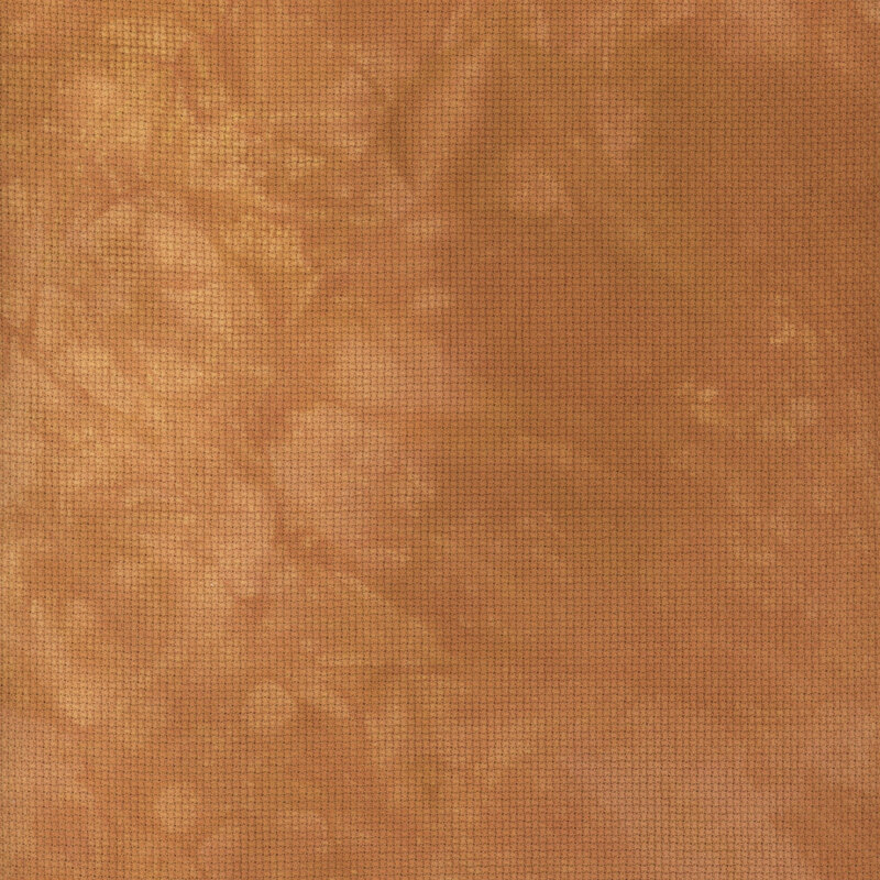 A close up swatch of marbled 14ct aida cloth in a lovely copper color by Fabric On A Whim.