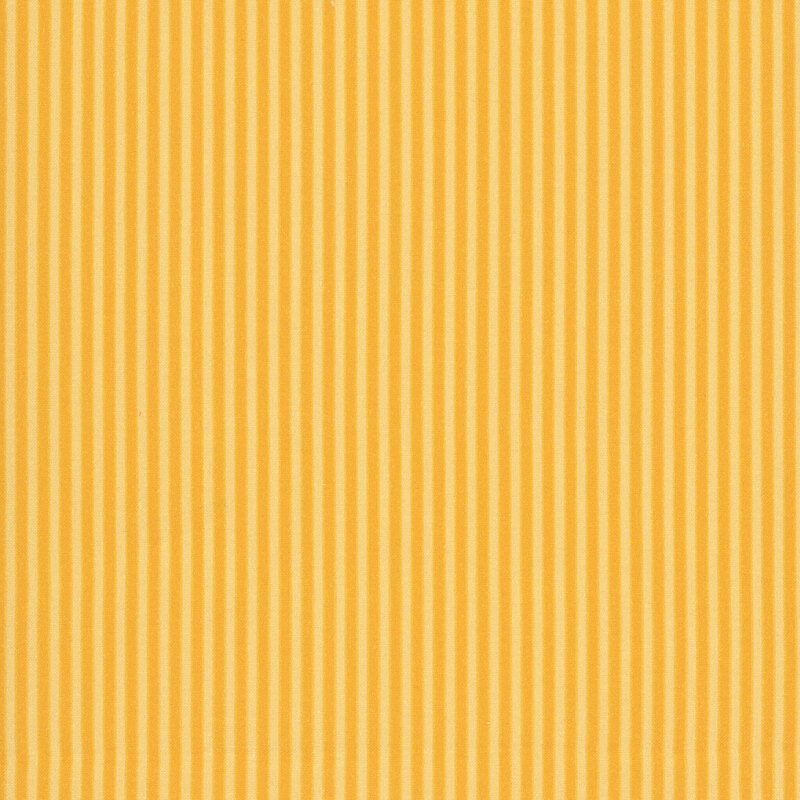 Fabric with narrow yellow and gold vertical stripes