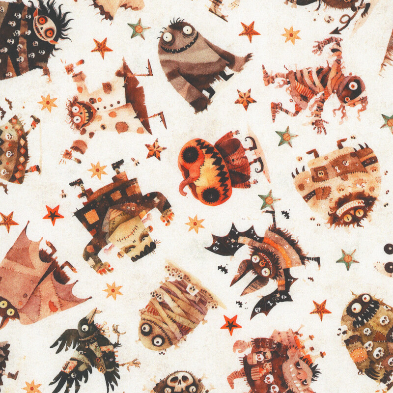 Textured white fabric featuring terrifying monsters and animals and decorated stars.