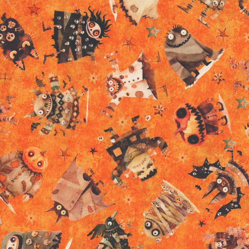 Textured orange fabric featuring terrifying monsters and animals and decorated stars.