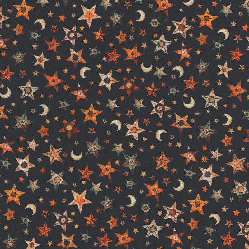 Pitch black fabric tossed with stars and moons.