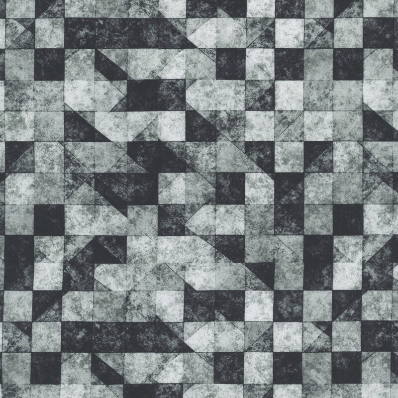 Textured gray and black fabric featuring a pattern of checkers and triangles.