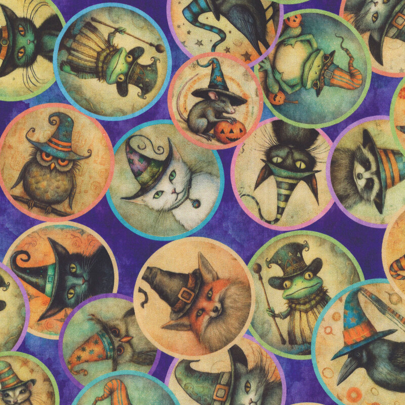 Mottled dark violet fabric featuring circular medallions of animal familiars dressed in Halloween-themed hats.