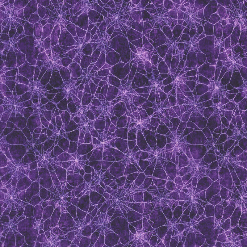 Mottled dark plum fabric covered in spider webs.