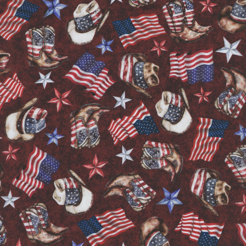 Textured deep burgundy fabric tossed with Americana-themed memorabilia of cowboy hats, boots, stars, and flags.