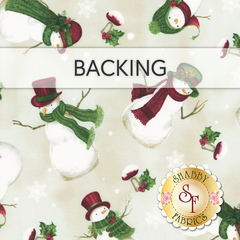 A cream swatch of fabric with tossed snowmen wearing hats and scarves. A banner at the top reads "Backing" and a gold Shabby Fabrics logo sits the the bottom right corner.