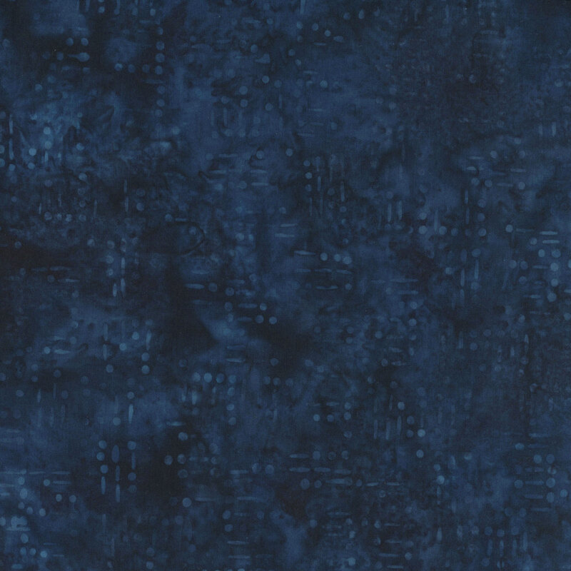 Mottled indigo fabric with a pattern of tonal dots and dashes resembling morse code