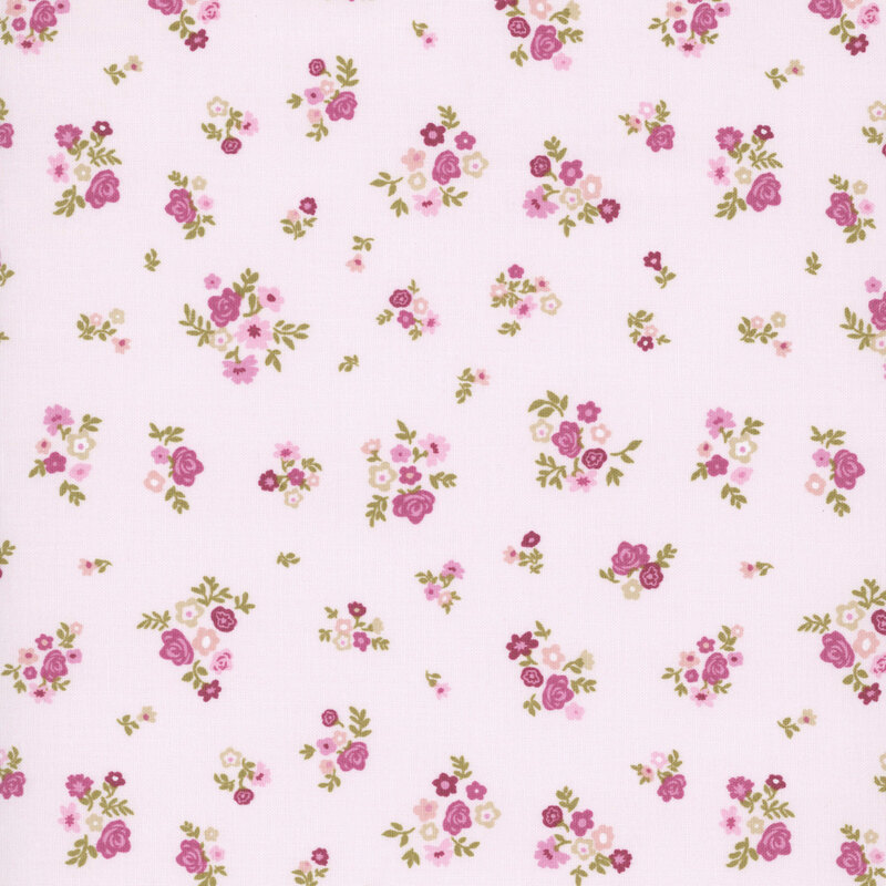 Pale pink fabric featuring bouquets of small flowers and roses.
