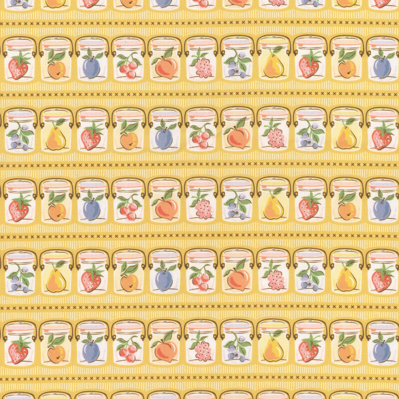 Rows of canning jars holding fresh fruits of the season on mustard yellow fabric.