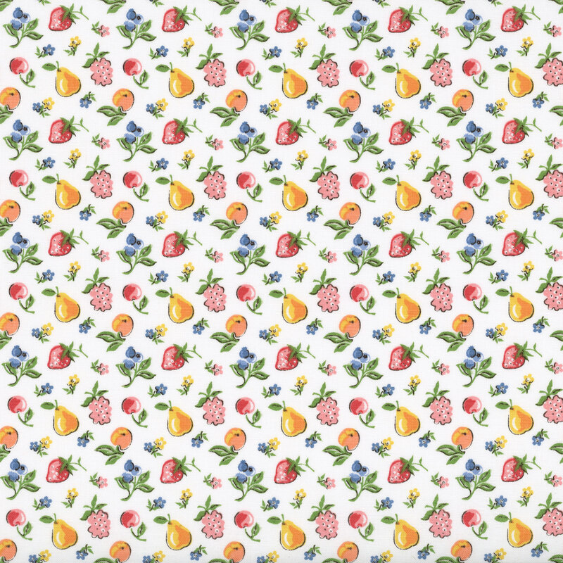Seasonal fruits and flowers tossed on white fabric.