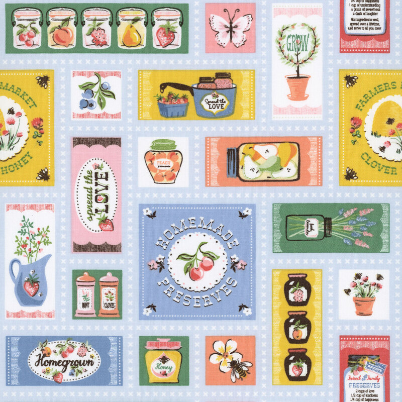 light blue fabric featuring various pictures of flowers, fruits, and homemade signs.