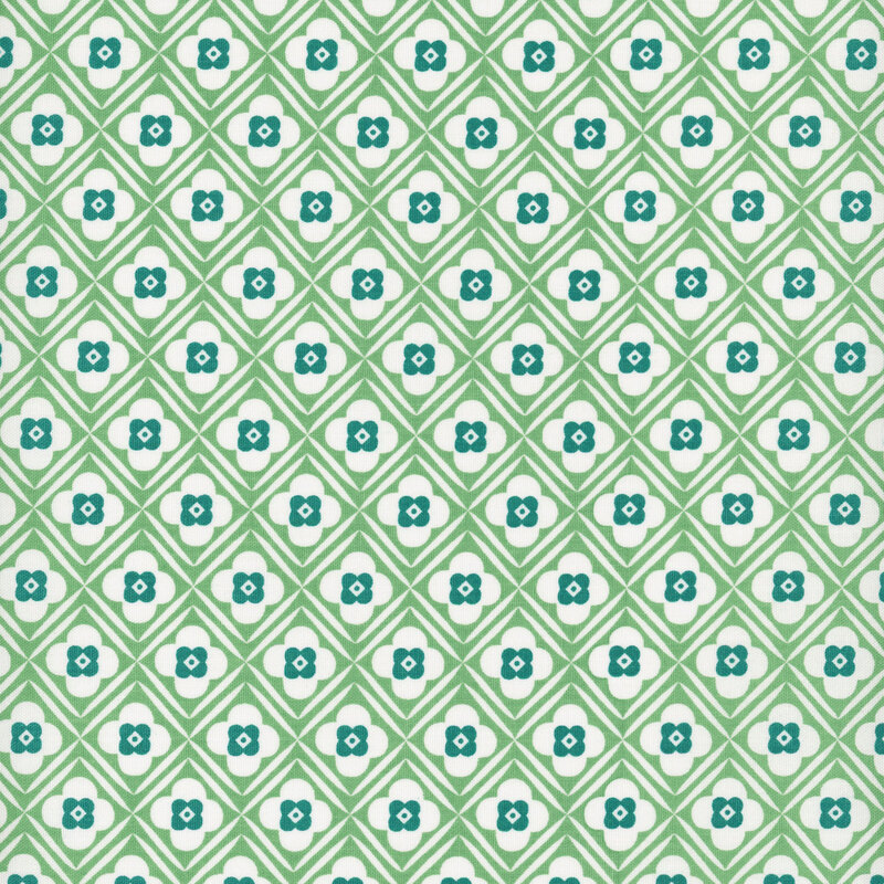 green diagonal lattice and teal floral design on white fabric.