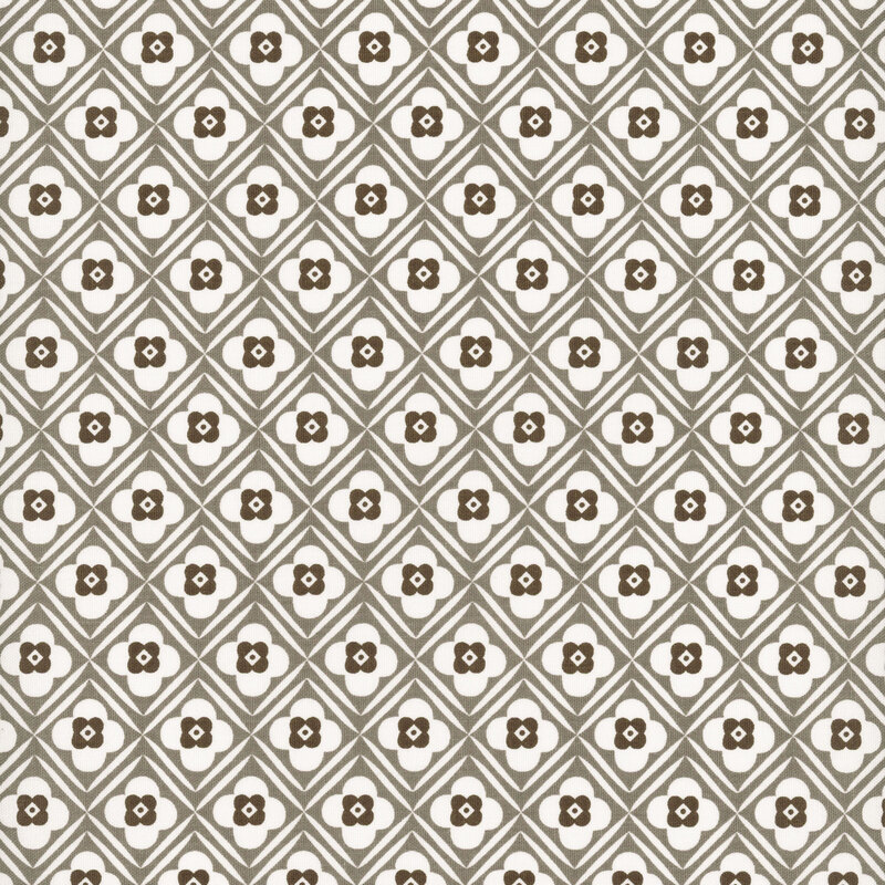 Steel gray diagonal lattice and floral design on white fabric.