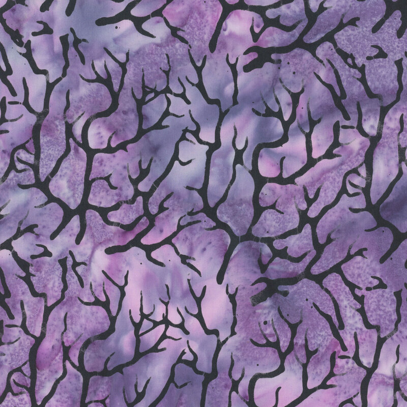 Mottled purple fabric with black hanging tree branches.