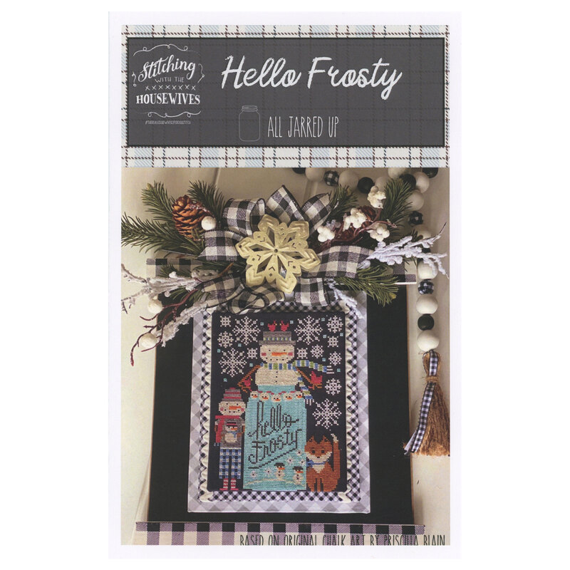 The front of the Hello Frosty All Jarred Up cross stitch pattern showing the completed project featuring a snowman in a jar surrounded by coordinating holiday décor. 