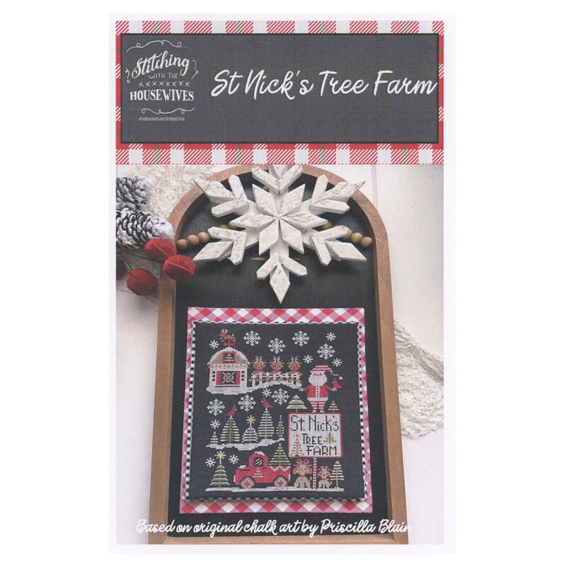 The front of the St. Nicks's Tree Farm cross stitch pattern showing the completed project surrounded by coordinating holiday décor. 