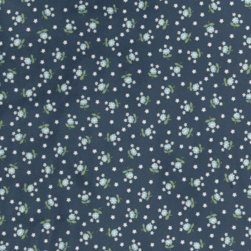 Navy blue fabric featuring small, light blue flowers tossed amongst white stars.