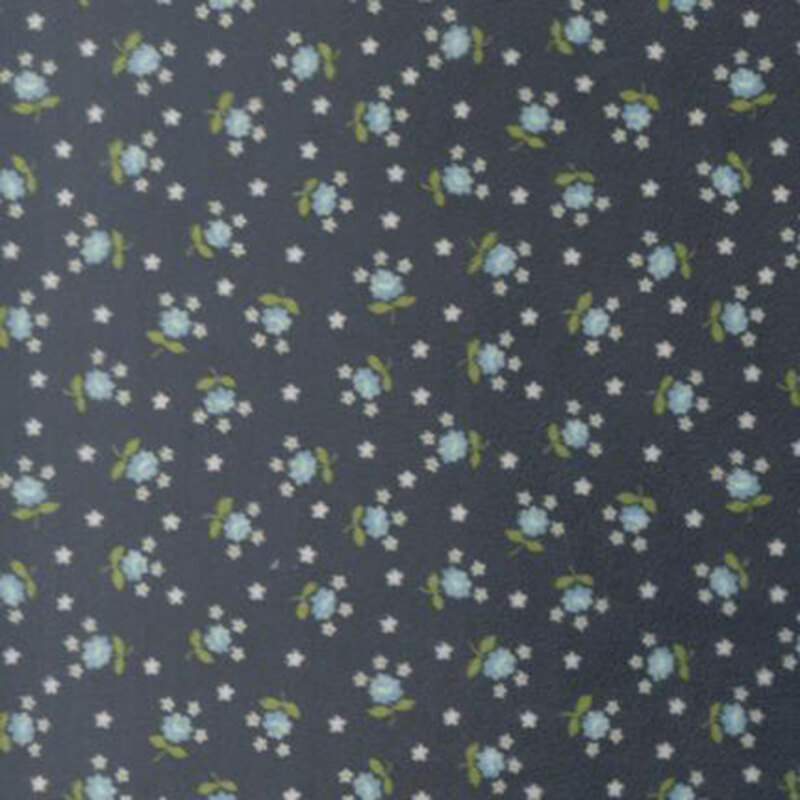 Navy blue fabric featuring small, light blue flowers tossed amongst white stars.