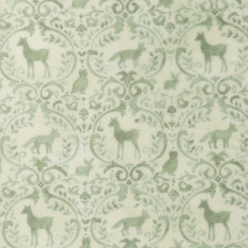 Cream fabric with a soft green ornamental pattern adorned with woodland animals and forest motifs.