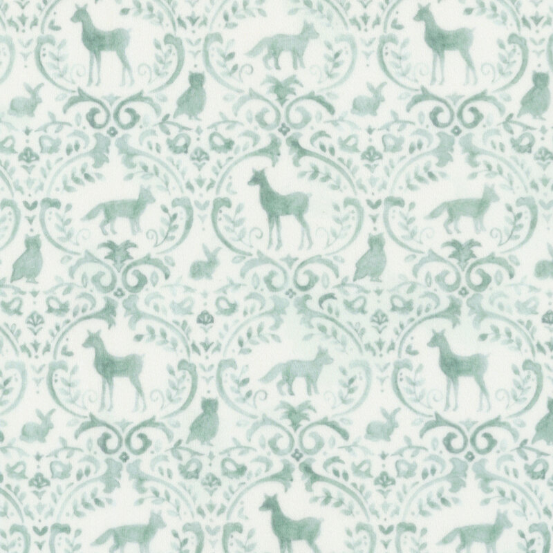 white fabric with a green ornamental pattern adorned with woodland animals and forest motifs.