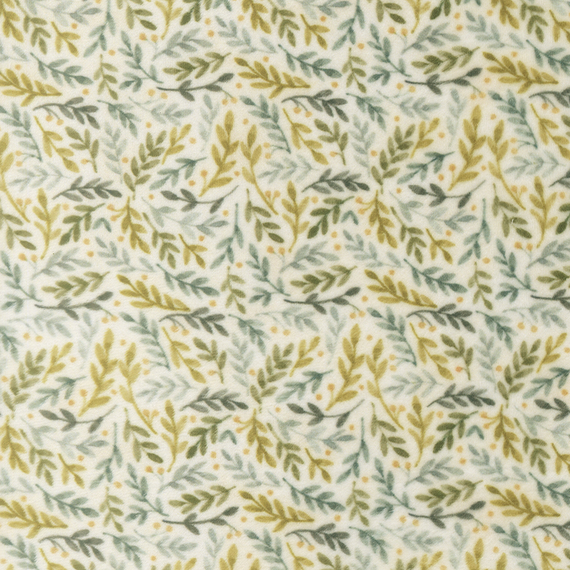 Cream fabric with a rich pattern of leaves in multiple shades of green.