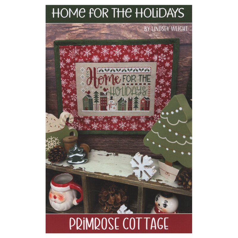 Front of the Home for the Holidays pattern showing the completed design finished into a pillow and staged with coordinating decor.