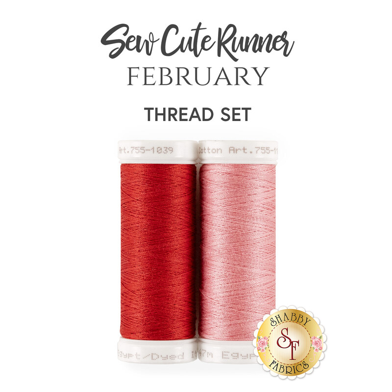 The coordinated thread set for the Sew Cute Runner - February table topper. A pink and red spool of thread sit next together beneath stylized text.