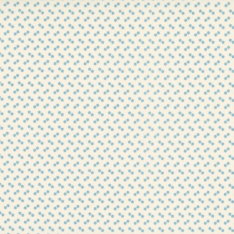 A cream fabric with a subtle chevron pattern of tiny, light blue flowers 