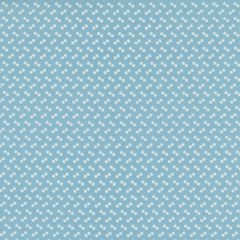 A light teal fabric with a subtle chevron pattern of tiny, white flowers