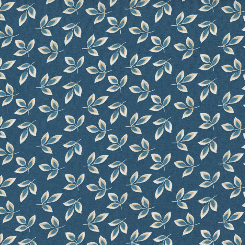 Indigo fabric with a dense pattern of cream and light blue leaves 
