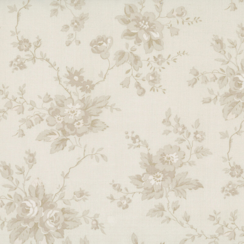 A tonal toile pattern of light beige florals and stems on a cream fabric 