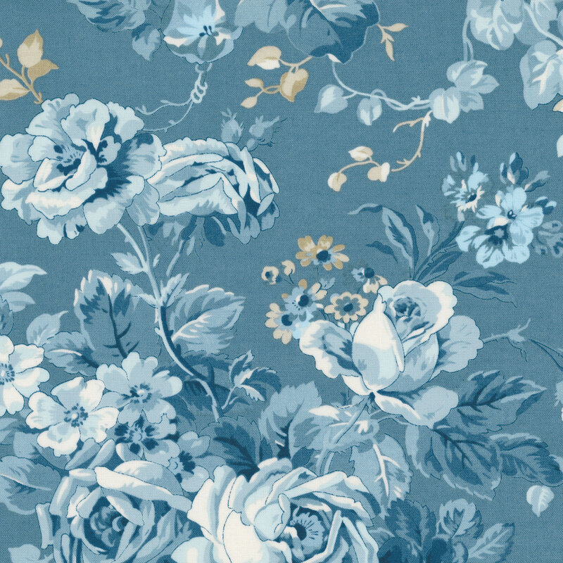 Denim blue fabric with a light blue and cream toile pattern of vintage floral bouquets