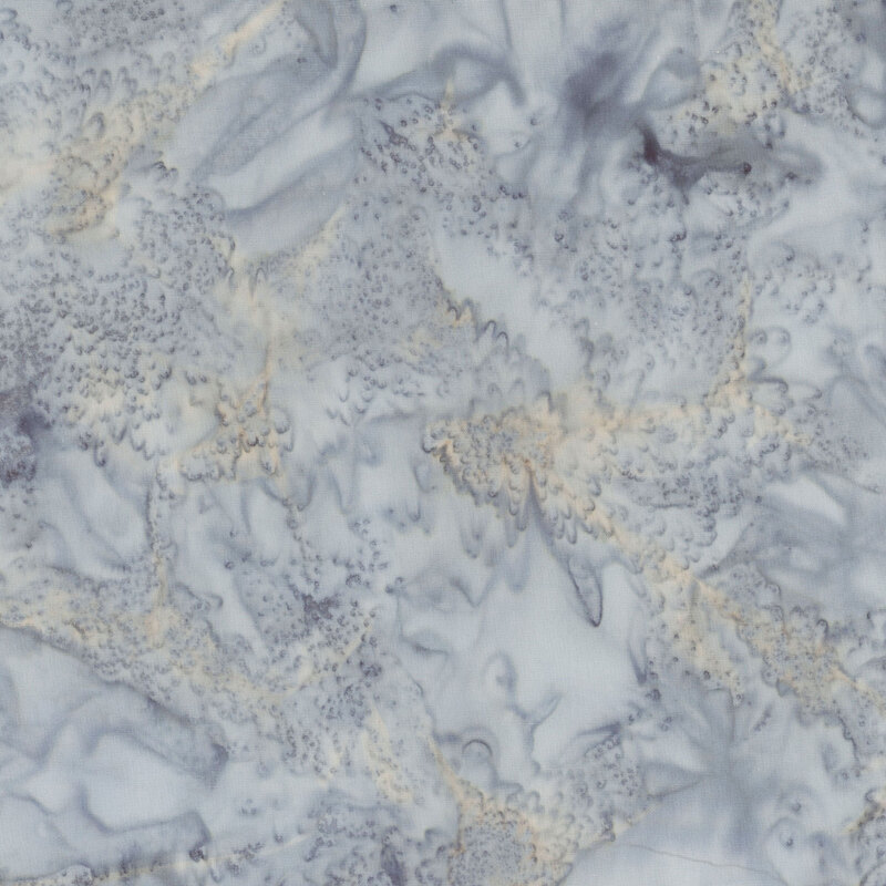 Marbled batik fabric in shades of gray and orange.