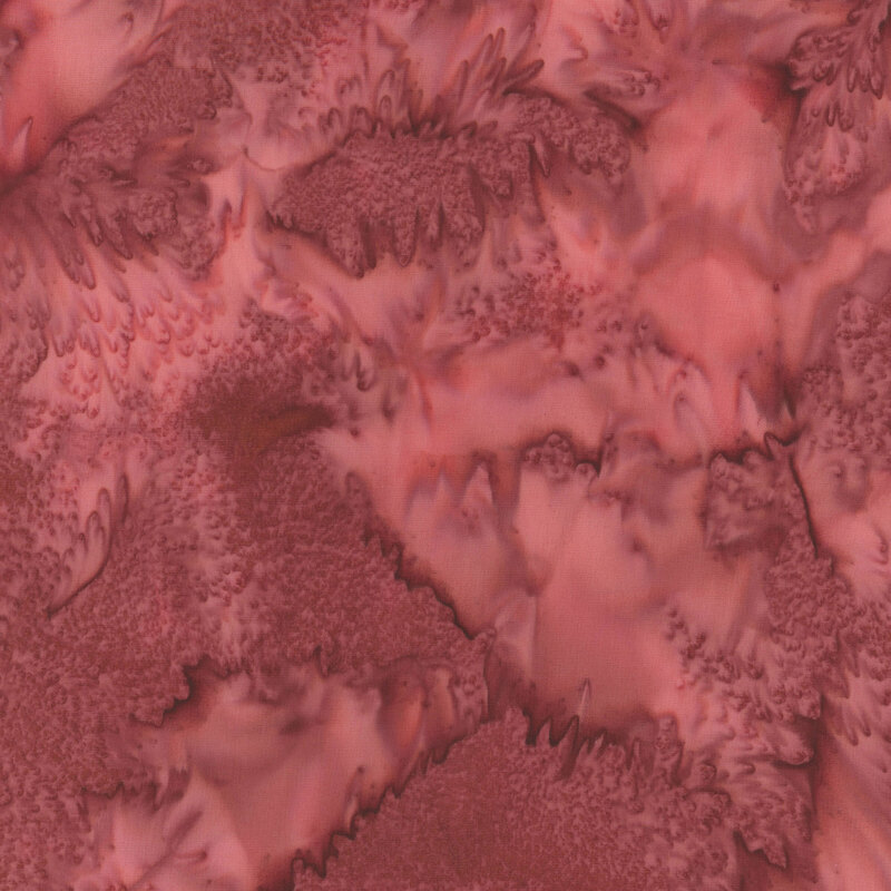 Marbled batik fabric in shades of barn red.